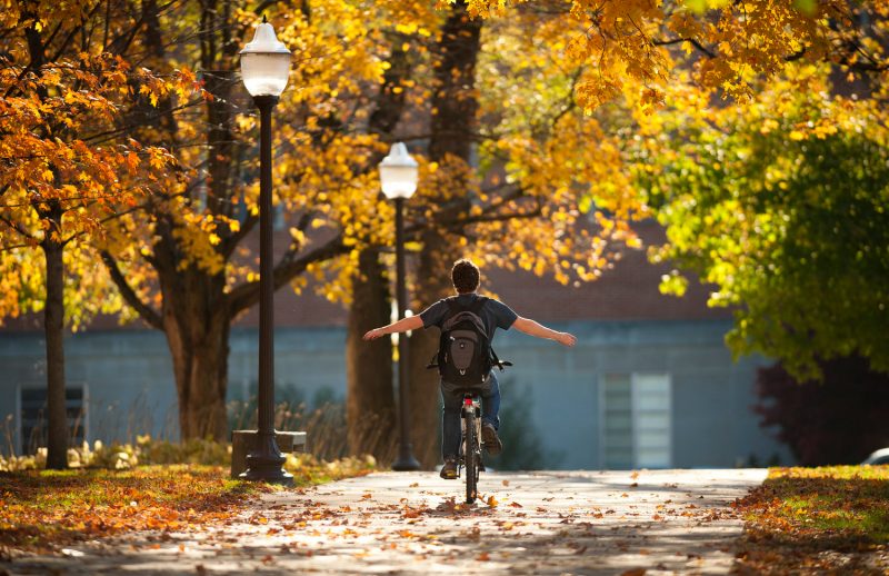 Student Biking in Fall