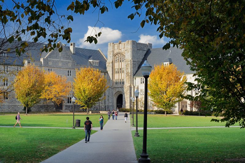 students walk across campus