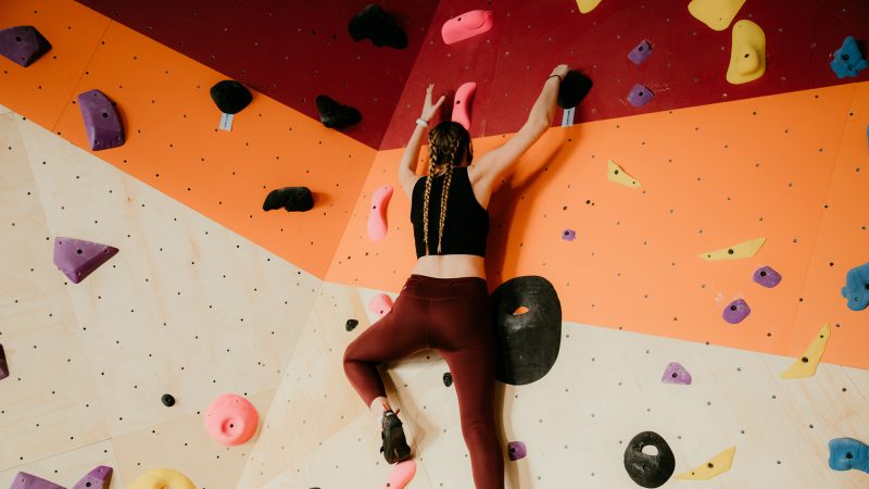 Student climbing at a climbing gym